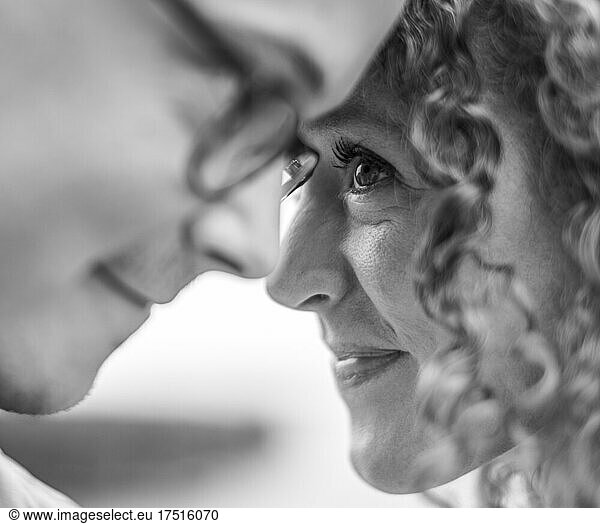 Close up of woman looking with love into husband's eyes