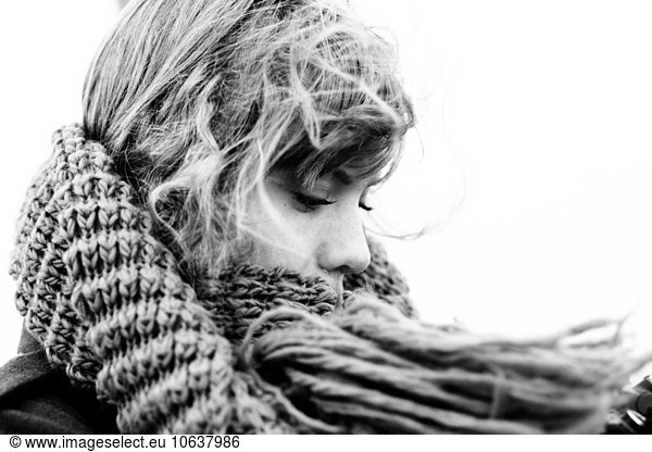 Close-up of young woman wearing scarf outdoors