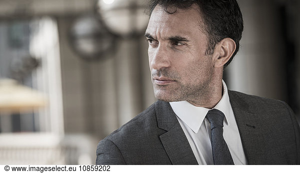 Close up pensive corporate businessman looking away