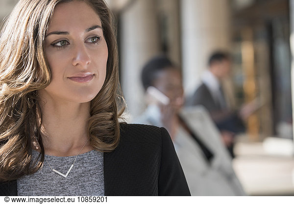 Close up pensive corporate businesswoman looking away