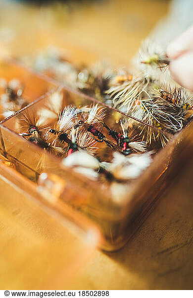 Close up photo of an assorted box of artificial flies