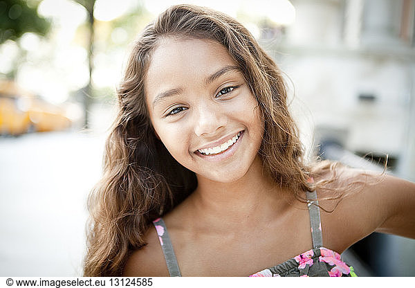 Close-up portrait of cheerful girl