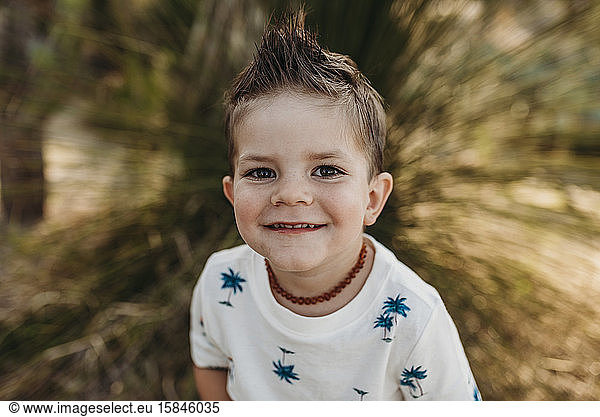 Close up portrait of cute young toddler boy smiling
