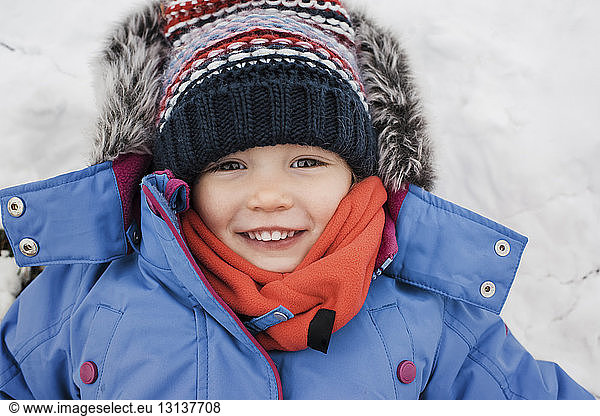Close-up portrait of girl wearing warm clothing