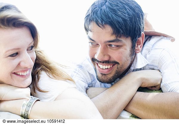 Close up portrait of happy couple making eye contact