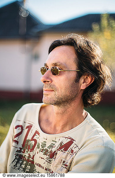 Close-up portrait of mature man with sunglasses