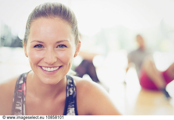 Close up portrait smiling woman in exercise class