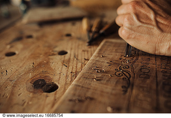 Close up process of engraving  decorating wooden panels