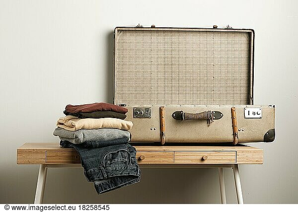 Close up vintage suitcase with casual clothes