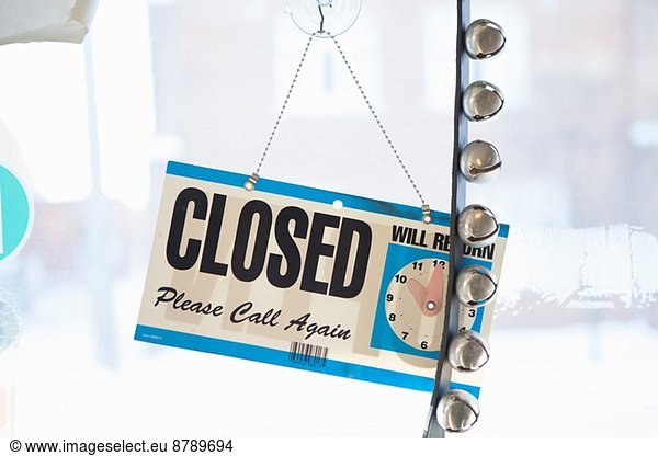 Closed sign on door of small business