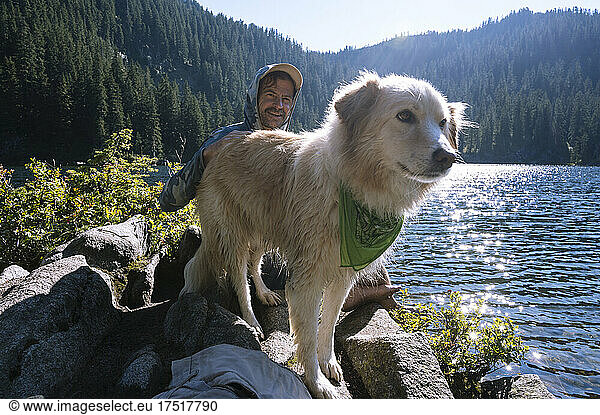 Closeup of dog next to an alpine lake