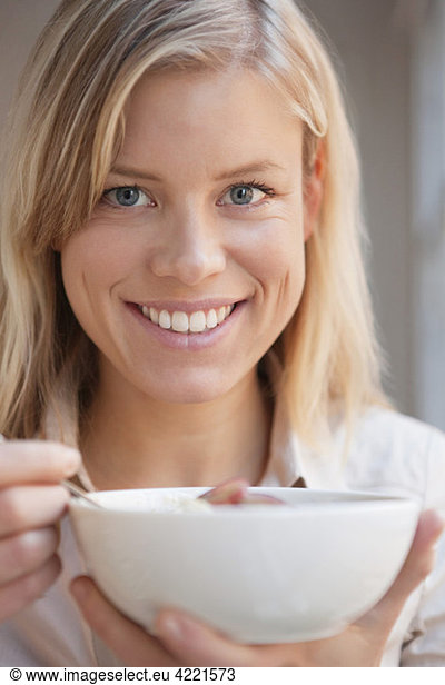 Closeup on woman holding her breakfast