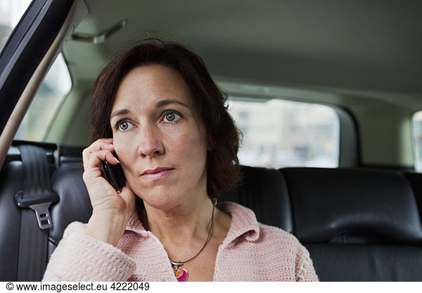 Closeup on woman talking in phone