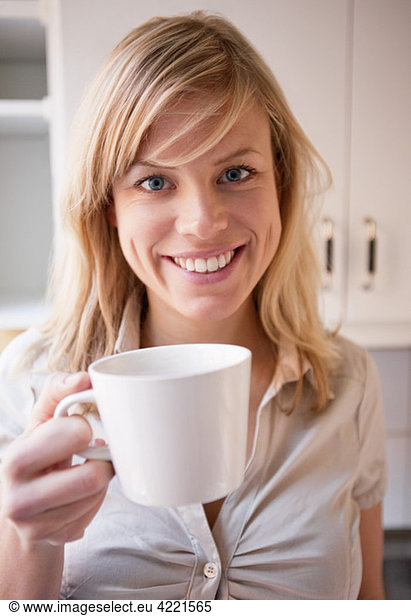 Closeup on woman with coffee cup in her hand