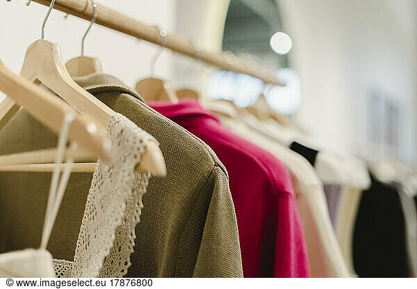 Clothes hanging on rack at store