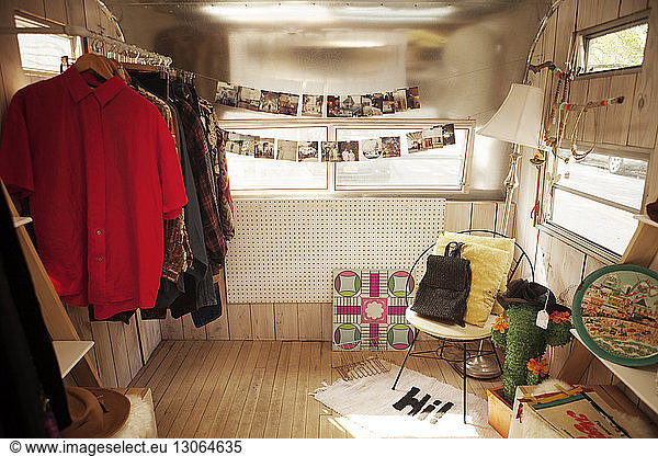 Clothes Rack and photographs in camper van