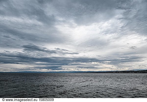 Cloud formation above Lake Constance  on the horizon the Swiss Alps  District of Constance  Baden-Württemberg  Germany  Europe