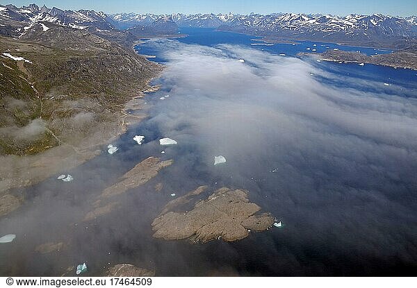 Clouds  icebergs  barren islands and snow-capped mountains  aerial view  Nanortalik  North America  Greenland  Denmark  North America
