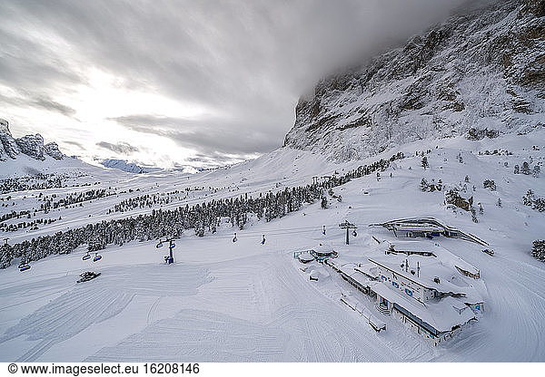 Clouds over the snowy slopes of Sella Pass ski area  Val Gardena  Dolomites  Trentino-Alto Adige  Italy  Europe