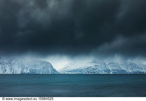 Cloudy atmosphere at the coast in winter  Fjord Lyngen  Skibotn  Norway
