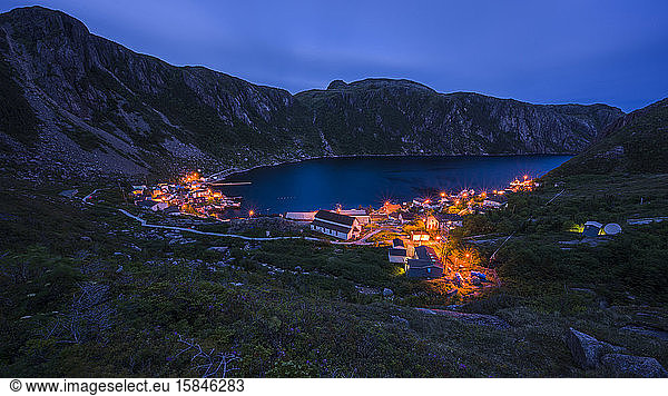 Cloudy Night over small village in fjord in Newfoundland