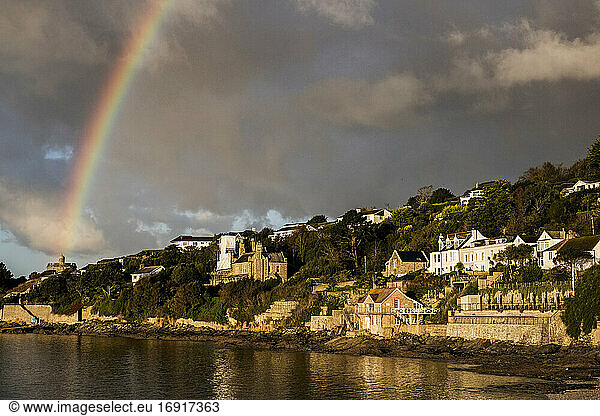 Cloudy sky with rainbow over Saint Mawes  Cornwall  UK.