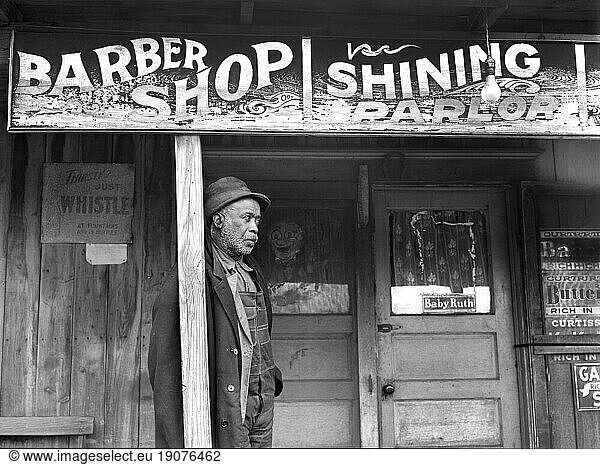 Coal miner standing outside barber shop  Colp  Illinois  USA  Arthur Rothstein  U.S. Farm Security Administration  January 1939