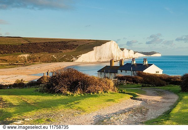 Coastguard Cottages and Seven Sisters cliffs in East Sussex England. South Downs National Park.