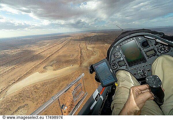 Cockpit of an aircraft  landing with a glider in the desert at Pokweni airfield  flying  cockpit  ASH32MI  instruments  control stick  hand  steer  control  salt pan  dunes  Namib  airfield  runway  landing  Pokweni  Namibia  Africa
