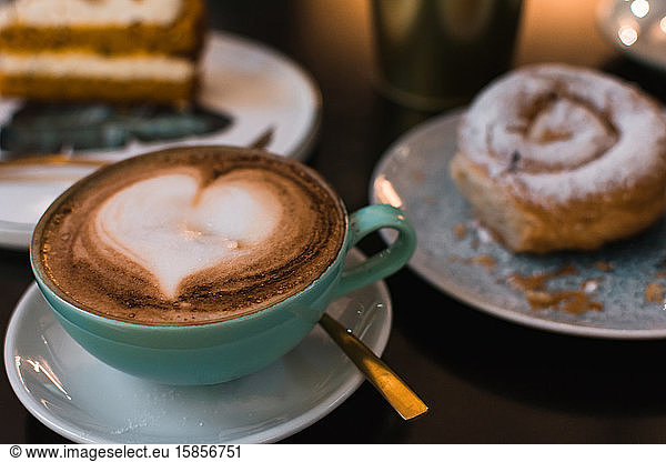 Coffee and pastries on a pub terrace. Close up image