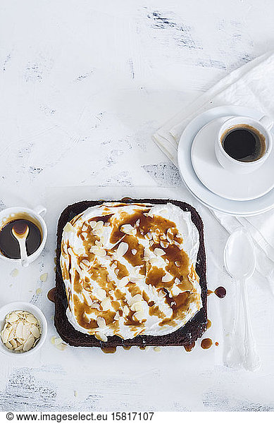 Coffee cake with whipped cream and caramel sauce