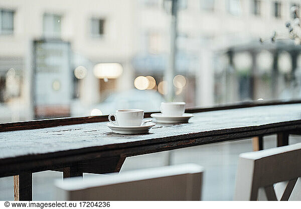 Coffee cup on table at cafe