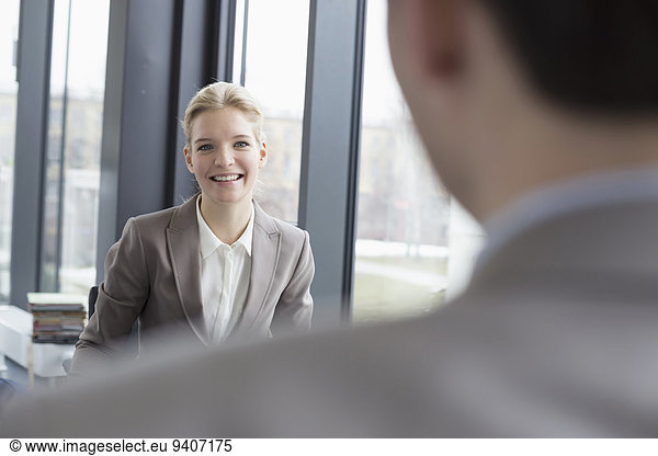 Colleagues counseling interview in office  smiling