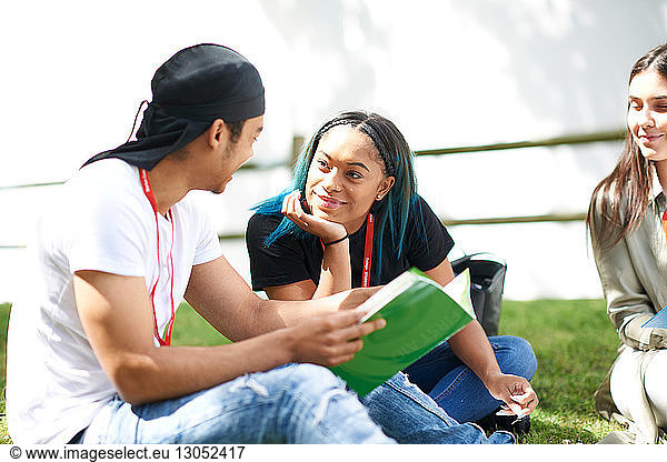 College students reading and talking in campus