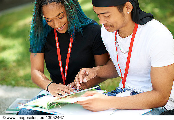 College students reading and talking in campus