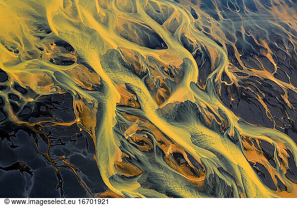 Colorful glacier rivers on the south coast of Iceland with black sand