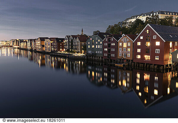Colorful houses during blue hour along Nidelva River in Trondhei