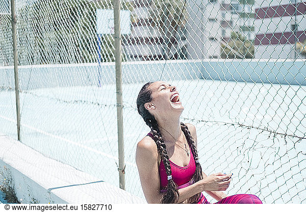 Colorful image of upper body of female athlete laughing