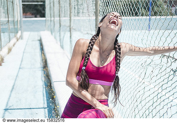 Colorful image of upper body of female athlete laughing