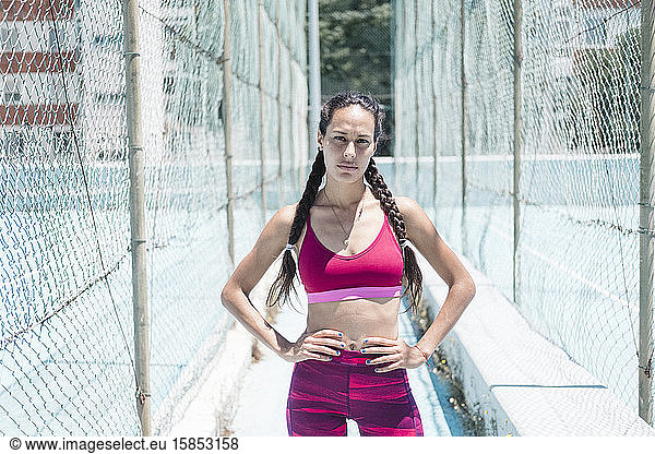 Colorful image of upper body of female athlete posing on court