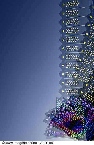 Colorful lights of spinning amusement park ride