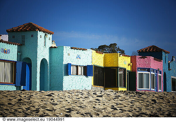 Colorful Mediterranean style hotel sits on the beach in Capitola  California  United States.