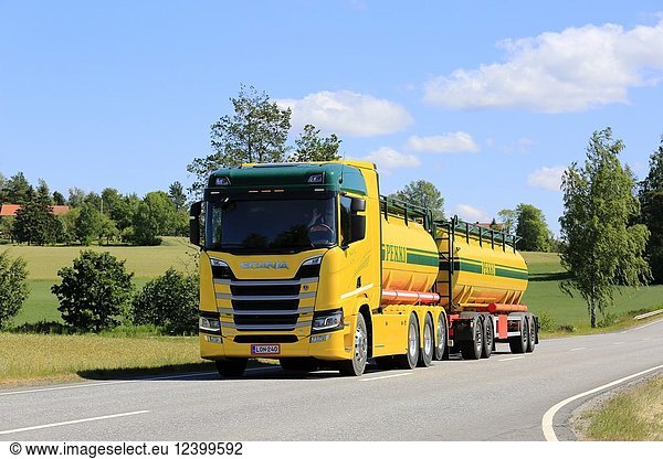 Colorful Next Generation Scania R580 V8 tank truck of K Pekki Oy on the road through Finnish rural scenery in summer. Salo  Finland - July 1  2018.