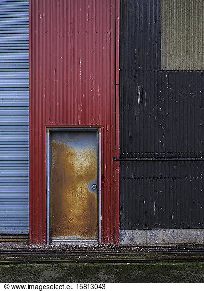 Colorfully painted warehouse exterior  doorway and loading area  Seattle  Washington