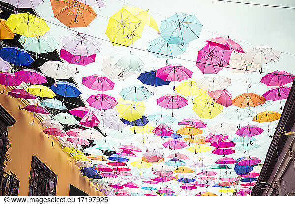 Colourful artistic installation of umbrellas