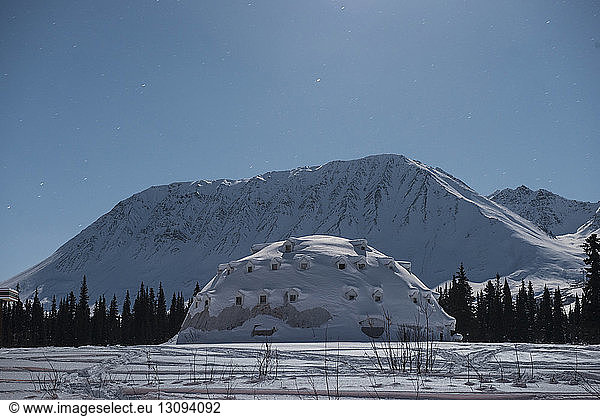 Concrete igloo against mountains and sky at Denali Highway