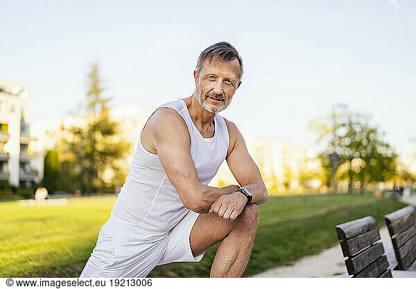 Confident athlete practicing sports training in park
