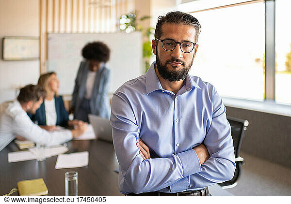 Confident businessman during meeting in office