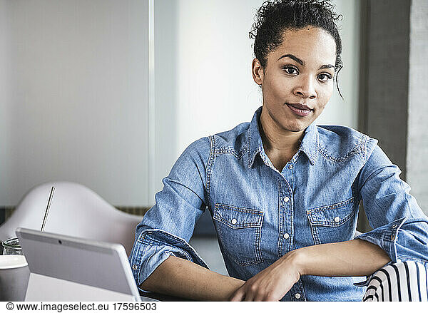Confident businesswoman sitting in office
