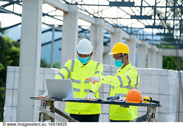 Construction manager and engineer use laptop working about proje